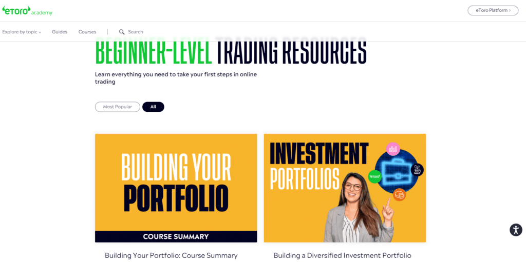 eToro's beginner-level trading resources page featuring guides and courses for building and managing investment portfolios.