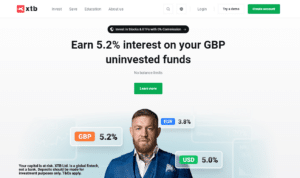 XTB online trading platform promoting 5.2% interest on GBP uninvested funds with competitive rates for EUR and USD, featuring a promotional banner with a financial expert.